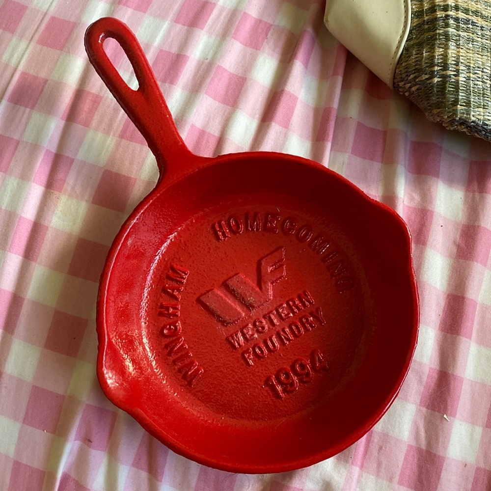 Red vintage cast iron frying pan